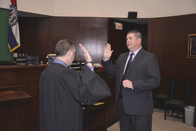 Photo of Lee Bucksath being sworn into office